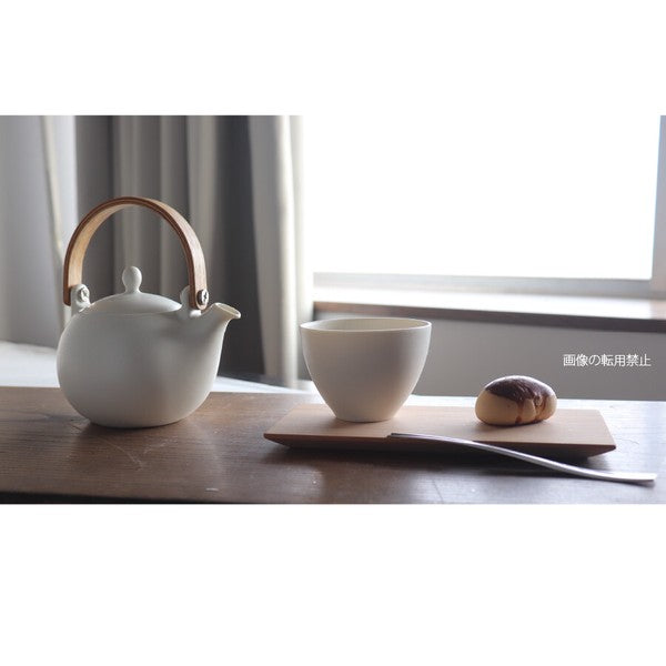 Long rectangle cherry wood tea coaster in use