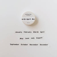 Masking tape with months printed on a white background