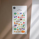 Sheet of colorful vegetable stickers on a white background