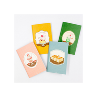 Four colorful notebooks with illustrations on a white background