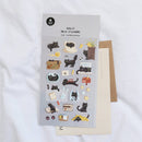 Sheet of black cat stickers with a brown envelope on a white background