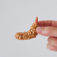 Ebi fry ceramic chopstick rest held in a hand