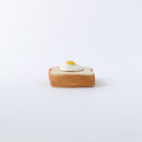 Egg toast ceramic chopstick rest, side view