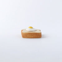 Egg toast ceramic chopstick rest, side view