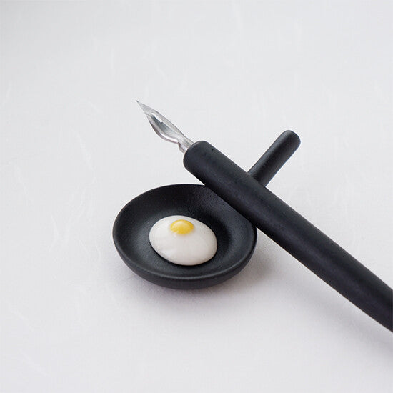Fried egg skillet ceramic chopstick rest with a dip pen