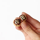 Takoyaki ceramic chopstick rest held in a hand